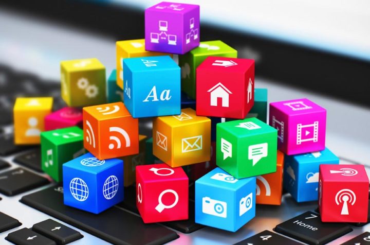 Colorful cubes with app icons on a keyboard.