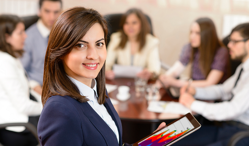 Smiling Female Business Leader Holding Tablet