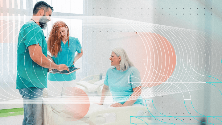 Medical staff talking with a patient in an examination room.