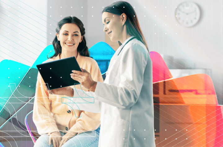 Doctor showing a patient data on a tablet, with a colorful abstract background.