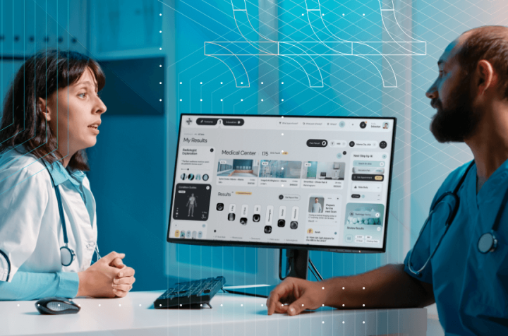 Doctors discussing medical test results on a monitor.