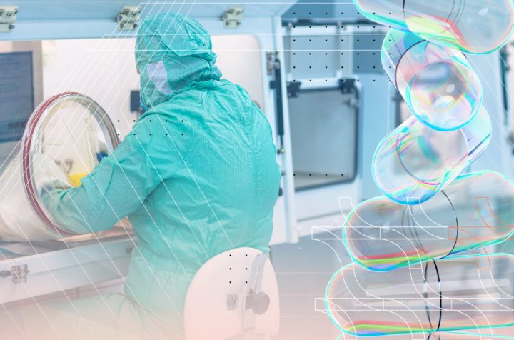 Sterile manufacturing operator working at an isolator in a GMP cleanroom environment under Annex 1 barrier technology requirements